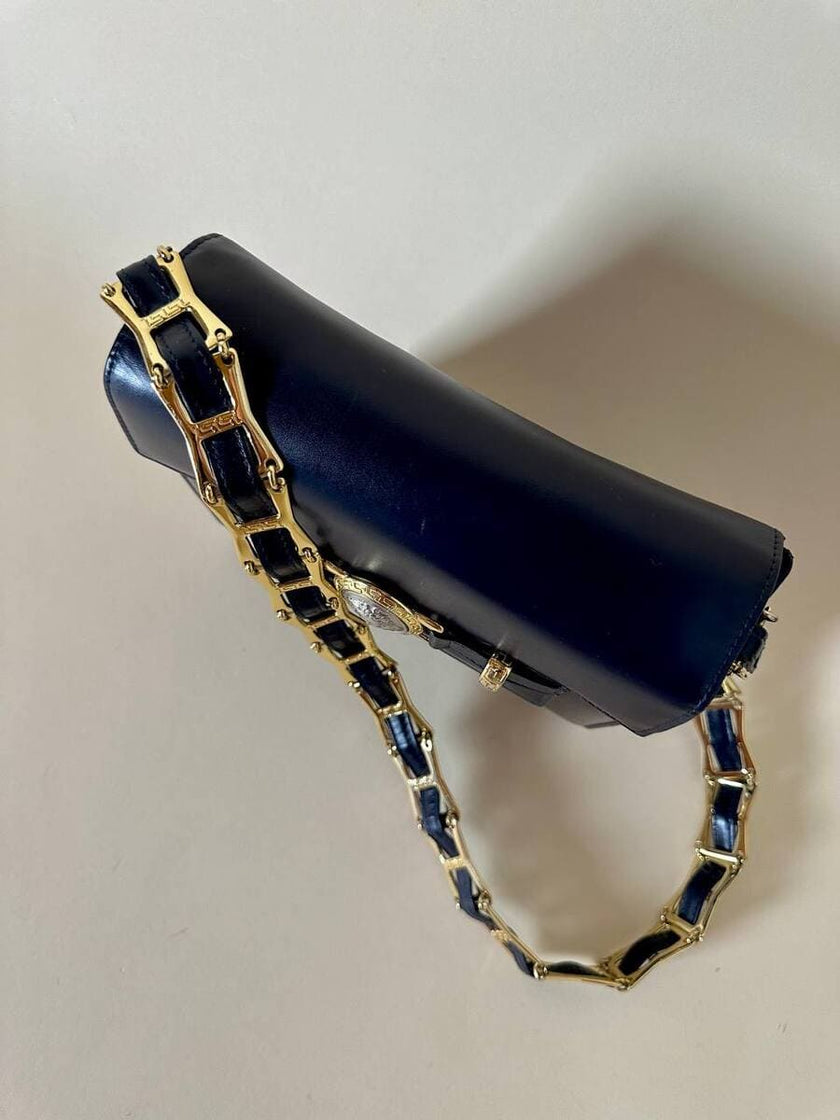 Borsa in pelle blu con hardware oro “Gianni Versace”