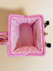 Borsa in rafia rosa lavorata con cordino in tinta