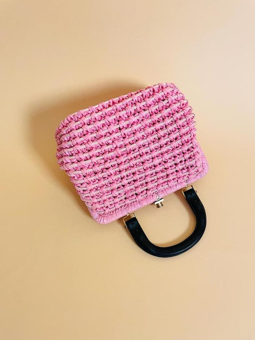 Borsa in rafia rosa lavorata con cordino in tinta