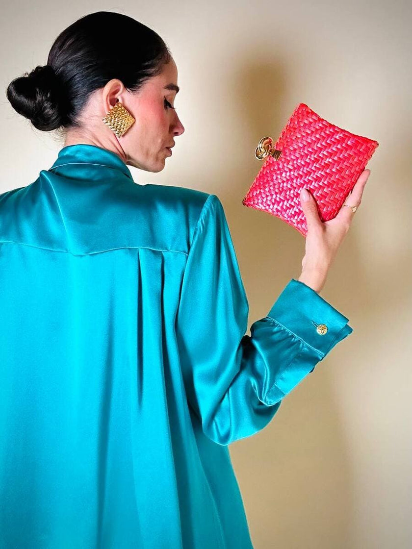 Borsa in midollino color geranio con chiusura a nodo e catena dorata “Rodo”