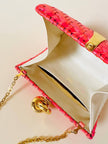 Borsa in midollino color geranio con chiusura a nodo e catena dorata “Rodo”