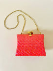 Borsa in midollino color geranio con chiusura a nodo e catena dorata “Rodo”