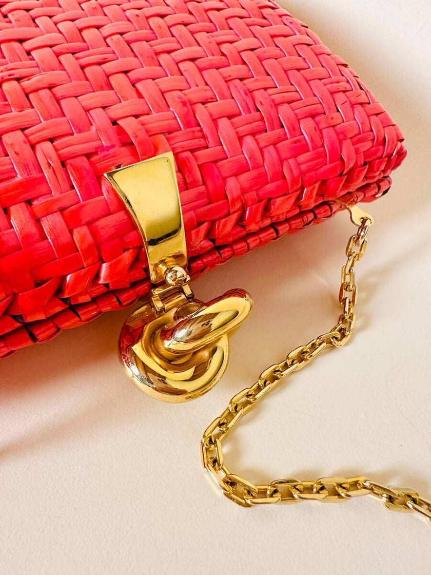 Borsa in midollino color geranio con chiusura a nodo e catena dorata “Rodo”