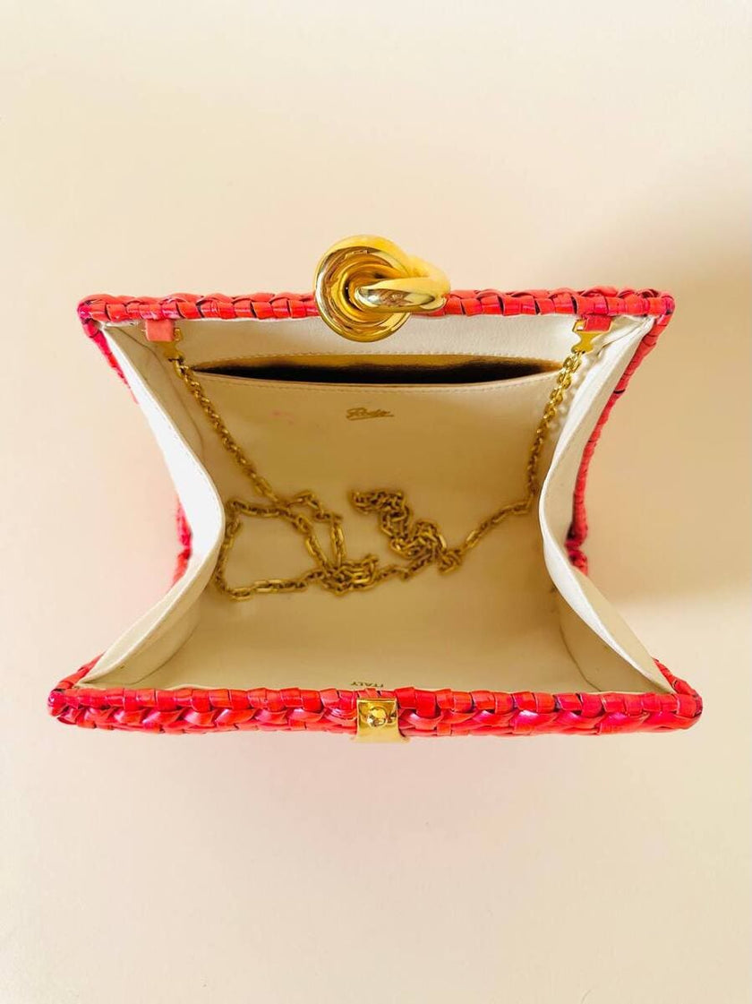 Borsa in midollino color geranio con chiusura a nodo e catena dorata “Rodo”