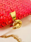 Borsa in midollino color geranio con chiusura a nodo e catena dorata “Rodo”