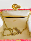 Borsa in midollino color geranio con chiusura a nodo e catena dorata “Rodo”