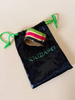 Bracciale rigido lavorato a righe con smalti multicolor “Krizia Poi”