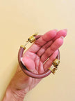 Bracciale rigido rosa antico con serpenti dorati