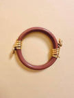 Bracciale rigido rosa antico con serpenti dorati