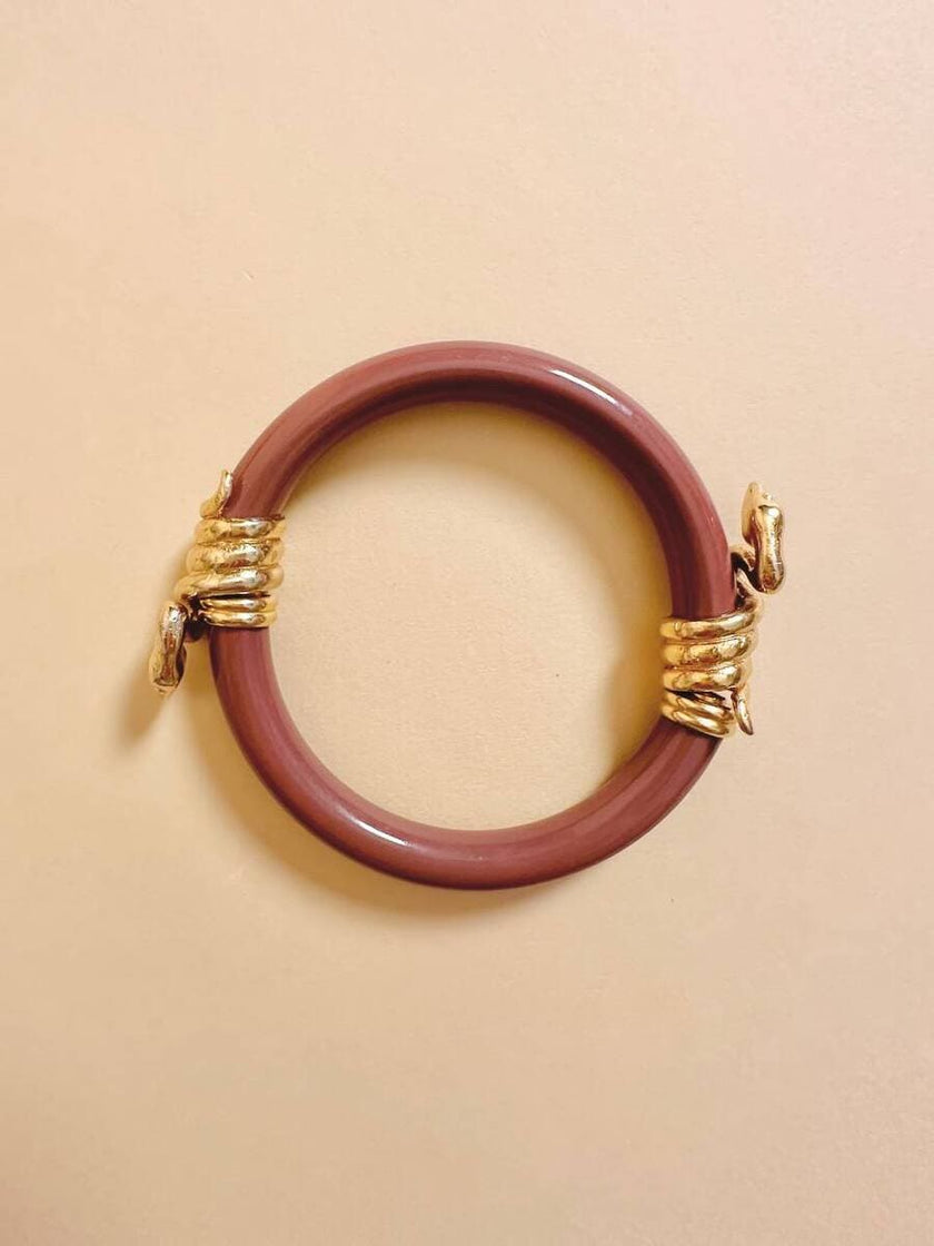 Bracciale rigido rosa antico con serpenti dorati