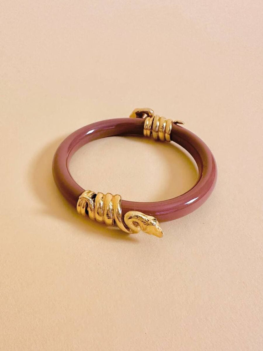 Bracciale rigido rosa antico con serpenti dorati