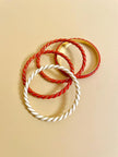 Bracciali torchon corallo e avorio