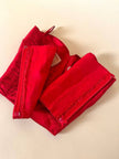 Bustier sartoriale in shantung rosso lavorato a pieghe