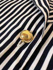 Camicia a righe bianche e blu “Nina Ricci”