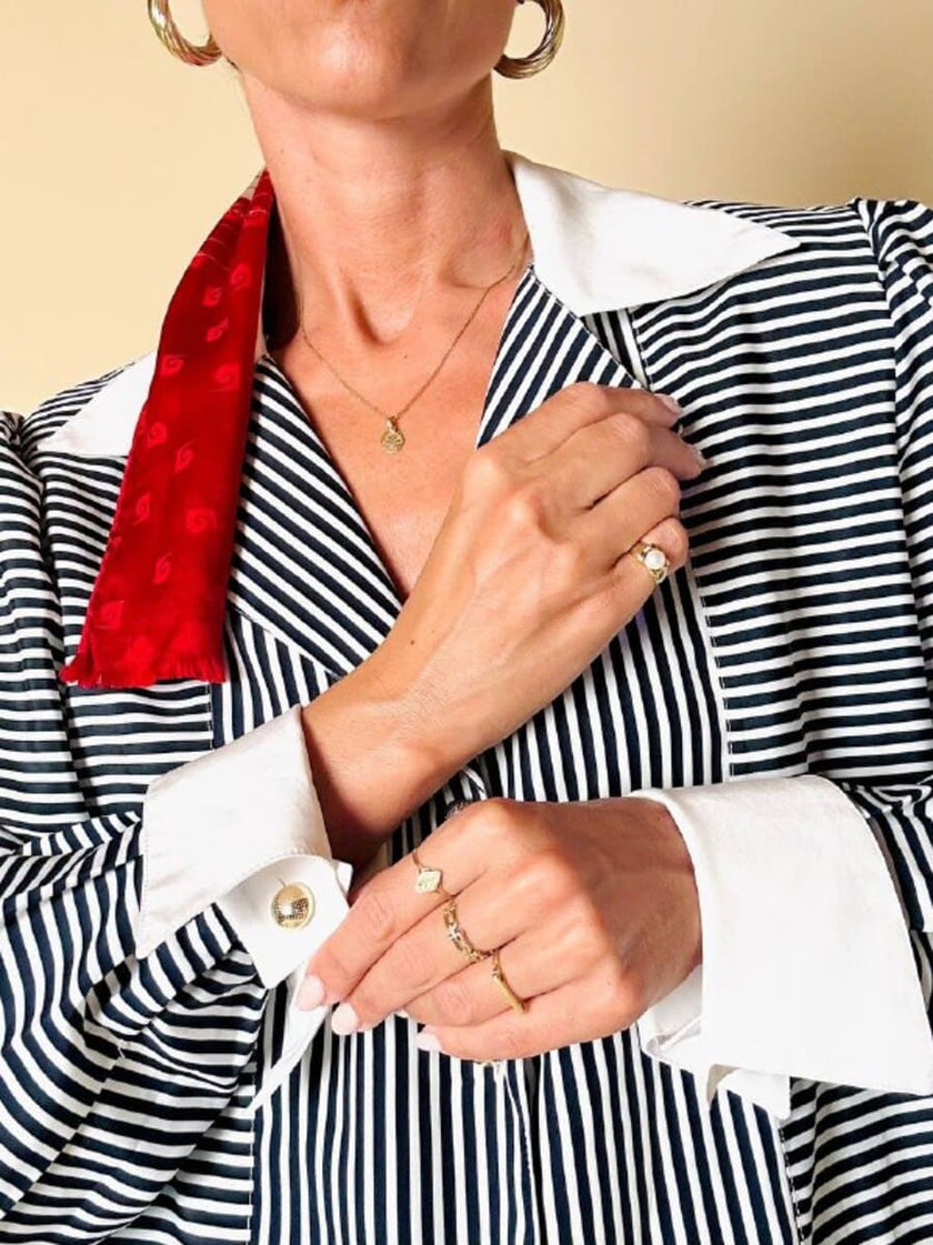 Camicia a righe bianche e blu “Nina Ricci”