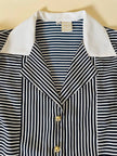 Camicia a righe bianche e blu “Nina Ricci”