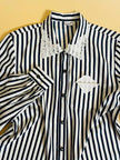Camicia a righe bianche e blu 
