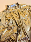Camicia in lamè oro con bottoni gioiello 