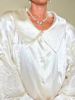 Camicia sartoriale in raso di seta avorio con inseriti di pizzo
