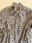 Camicia oversize con fiocco al collo fango e nera
