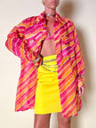 Camicia oversize in organza a righe nei toni del fucsia e arancione “Nina Ricci”