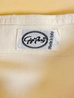 Camicia oversize in seta avorio con abbottonatura asimmetrica “Gigi Pary”