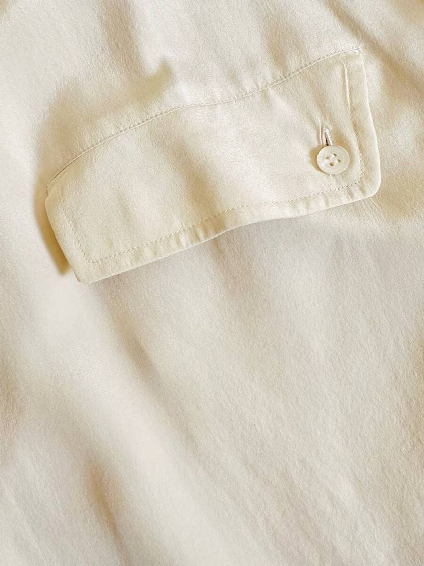 Camicia oversize in seta avorio con abbottonatura asimmetrica “Gigi Pary”