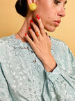 Button clip in paillettes giallo crema