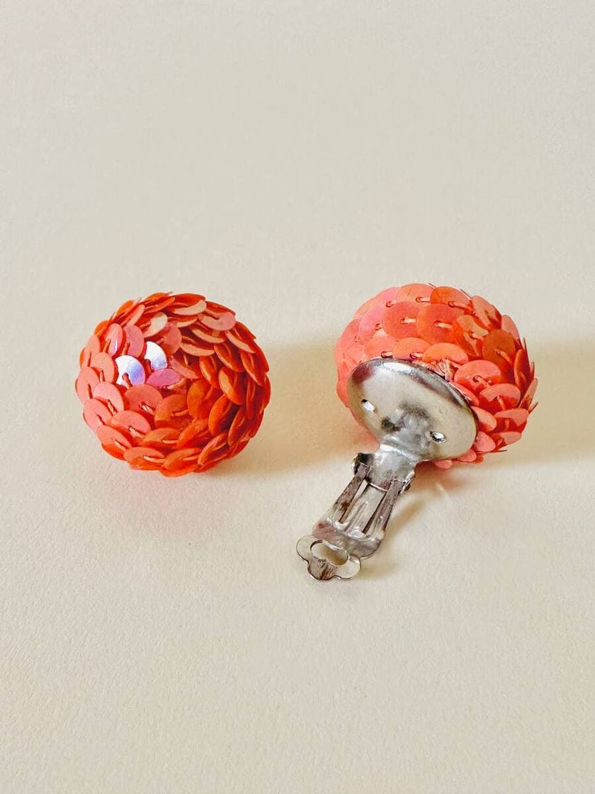 Clip a bottone in paillettes rosa salmone