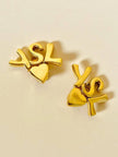 Clip dorate con cuore e iniziali YSL 