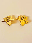 Clip dorate con cuore e iniziali YSL 