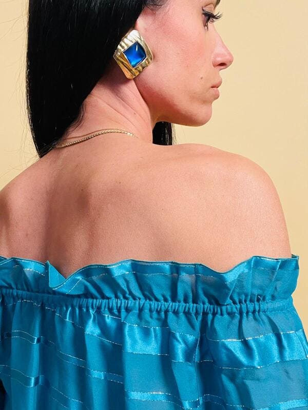 Maxi clip oro con pietra blu