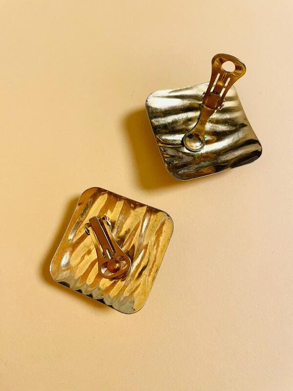 Maxi clip oro con pietra blu