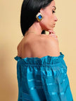 Maxi clip oro con pietra blu