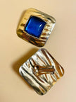 Maxi clip oro con pietra blu
