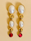 Clip pendenti con perle cabochon e strass rossi