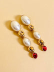 Clip pendenti con perle cabochon e strass rossi