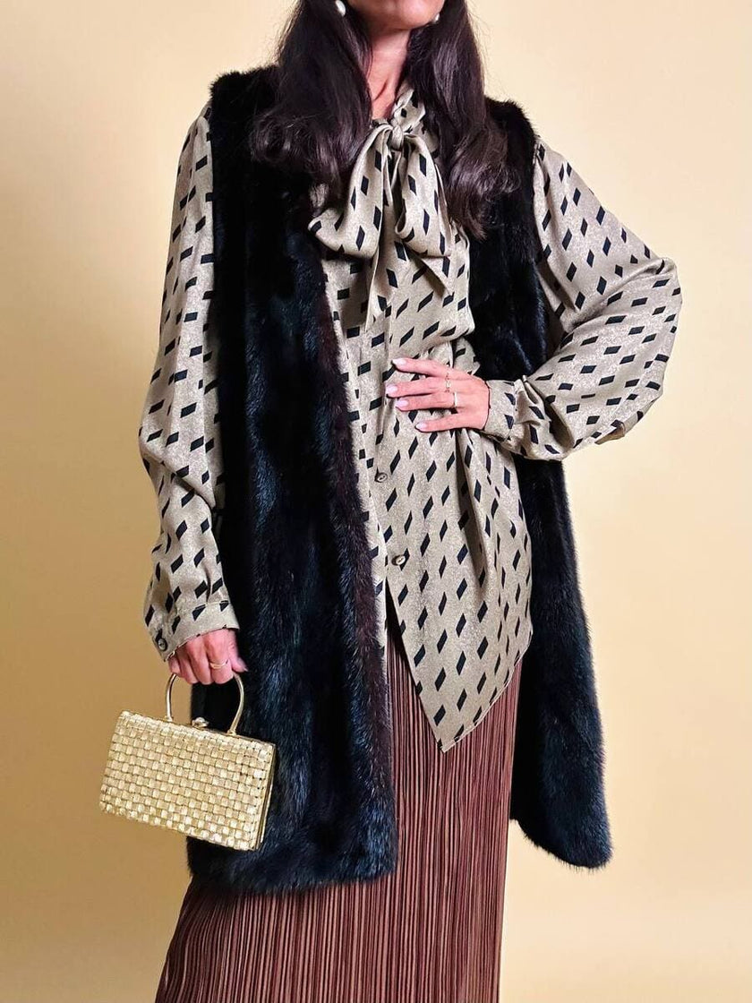 Clutch in metallo oro con motivo a intreccio