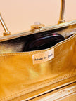 Clutch in metallo oro con motivo a intreccio