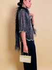 Clutch in metallo oro con motivo a intreccio