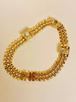 Collier in maglia metallica oro con cristalli incastonati