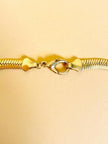 Collier dorato con fiocco di strass