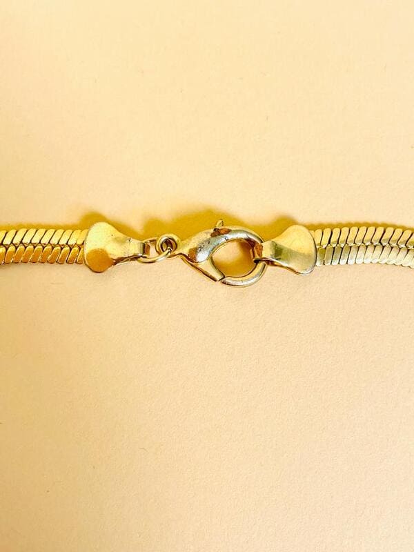 Collier dorato con fiocco di strass