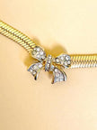 Collier dorato con fiocco di strass