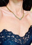 Collier dorato con fiocco di strass