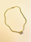 Collier dorato con fiocco di strass