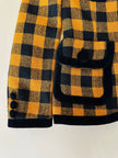Giacca in lana fantasia damier giallo e nero con riporti di velluto “C’est Commeca”