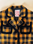 Giacca in lana fantasia damier giallo e nero con riporti di velluto “C’est Commeca”