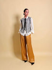 Pantalone a palazzo in cady lucido color ambra 