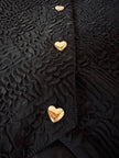 Gilet nero goffrato con bottoni dorati a forma di cuore “Yves Saint Laurent”